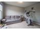 Versatile room furnished with a comfy couch and fitness equipment, perfect for relaxation or exercise at 5374 John Quincy Adams Ct, Plainfield, IN 46168