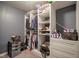 Organized walk-in closet with custom shelving, hanging rods, and built-in drawers for optimal storage at 5374 John Quincy Adams Ct, Plainfield, IN 46168