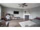 Inviting living room featuring a fireplace, hardwood floors, and a TV above the mantel at 5374 John Quincy Adams Ct, Plainfield, IN 46168