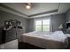 Comfortable main bedroom featuring a dresser, a large window, and neutral decor at 5374 John Quincy Adams Ct, Plainfield, IN 46168
