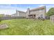 Lush backyard featuring a covered patio, privacy fence, and plenty of room for outdoor activities at 5671 Glass Chimney Ln, Indianapolis, IN 46235