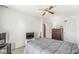 Comfortable bedroom featuring neutral decor, carpeted floors, and overhead fan at 5671 Glass Chimney Ln, Indianapolis, IN 46235
