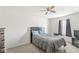 Comfortable bedroom featuring neutral decor, carpeted floors, and overhead fan at 5671 Glass Chimney Ln, Indianapolis, IN 46235