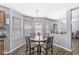 Cozy dining area with natural light, perfect for Gathering meals and entertaining guests in a welcoming space at 5671 Glass Chimney Ln, Indianapolis, IN 46235