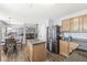 Open kitchen concept connecting to the living room, perfect for entertaining, featuring stainless steel appliances at 5671 Glass Chimney Ln, Indianapolis, IN 46235