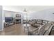 Inviting living room with a fireplace, large windows, and hardwood floors, offering a comfortable and stylish space at 5671 Glass Chimney Ln, Indianapolis, IN 46235