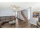 Open-concept living room seamlessly connects to the kitchen, offering a spacious and inviting area for Gathering and guests at 5671 Glass Chimney Ln, Indianapolis, IN 46235