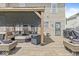 Covered patio featuring comfortable outdoor seating, a cozy ambiance, and a built-in grill at 5671 Glass Chimney Ln, Indianapolis, IN 46235