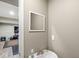 Neutral powder room featuring a modern sink and mirror at 5671 Glass Chimney Ln, Indianapolis, IN 46235