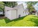 Well-manicured backyard features lush green grass and white siding at 60 E Poplar St, Zionsville, IN 46077