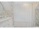 Bathroom features floral wallpaper and a shower with a floral-patterned shower curtain at 60 E Poplar St, Zionsville, IN 46077