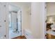 Mudroom with built-in storage and bench, leading to laundry and bedroom at 60 E Poplar St, Zionsville, IN 46077