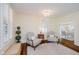 Comfortable living room featuring hardwood floors, a cozy seating arrangement, and natural light at 60 E Poplar St, Zionsville, IN 46077