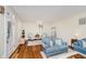 Comfortable living room featuring hardwood floors, a cozy seating arrangement, and natural light at 60 E Poplar St, Zionsville, IN 46077