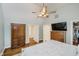 Open main bedroom with wood floors, walk-in closet, and view of the ensuite bathroom at 60 E Poplar St, Zionsville, IN 46077