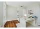 Bright office featuring a glass desk, hardwood floors, and built-in shelving at 60 E Poplar St, Zionsville, IN 46077