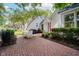 Inviting brick patio with outdoor dining set and lush landscaping at 60 E Poplar St, Zionsville, IN 46077