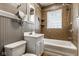 Cozy bathroom featuring a shower/tub combo and updated fixtures at 6264 Central Ave, Indianapolis, IN 46220
