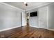Spacious bedroom with hardwood floors, two closets, and neutral paint at 6264 Central Ave, Indianapolis, IN 46220