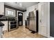 Fully equipped kitchen with stainless steel appliances and access to the backyard at 6264 Central Ave, Indianapolis, IN 46220
