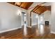 Spacious living room showcasing hardwood floors, a fireplace, and an open doorway at 6264 Central Ave, Indianapolis, IN 46220