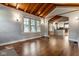Open-concept living space with hardwood floors and vaulted wood ceilings at 6264 Central Ave, Indianapolis, IN 46220
