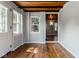 Bright room with hardwood floors and views through an open doorway at 6264 Central Ave, Indianapolis, IN 46220