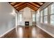 Bright Living room with hardwood floors, white brick fireplace and natural lighting at 6264 Central Ave, Indianapolis, IN 46220