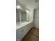 Bathroom featuring double sinks and a large vanity with quartz countertops at 6338 Rippling Rock Dr, Plainfield, IN 46168
