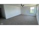 Bright and spacious bedroom with carpet flooring and ample natural light at 6338 Rippling Rock Dr, Plainfield, IN 46168