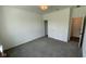 Well-lit bedroom with neutral carpet, white walls, and a closet, providing a blank canvas for your personal style at 6338 Rippling Rock Dr, Plainfield, IN 46168