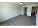 Inviting bedroom with neutral carpet, white walls, a closet, and ample natural light, offering comfort and tranquility at 6338 Rippling Rock Dr, Plainfield, IN 46168