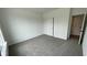 Clean and bright bedroom with a large closet and neutral carpet at 6338 Rippling Rock Dr, Plainfield, IN 46168