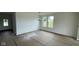 Bright dining area with lots of natural light and modern light fixture at 6338 Rippling Rock Dr, Plainfield, IN 46168