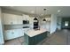 Modern kitchen featuring an island with counter seating and stainless steel appliances at 6338 Rippling Rock Dr, Plainfield, IN 46168