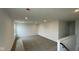 Loft with lots of light coming in from the large windows at 6338 Rippling Rock Dr, Plainfield, IN 46168