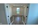 Office with modern french doors and beautiful wood-style floors at 6338 Rippling Rock Dr, Plainfield, IN 46168
