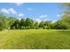 Large green backyard offering plenty of space and mature trees at 6498 N County Road 475 E, Pittsboro, IN 46167