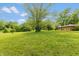 Expansive grassy backyard perfect for outdoor activities and enjoying nature at 6498 N County Road 475 E, Pittsboro, IN 46167