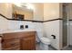 Bathroom featuring a wood vanity, white tile walls, and a glass door shower at 6498 N County Road 475 E, Pittsboro, IN 46167
