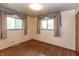 Bedroom with hardwood floors and two windows providing natural light at 6498 N County Road 475 E, Pittsboro, IN 46167