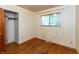 Bedroom with hardwood floors, one window for natural light and an open closet at 6498 N County Road 475 E, Pittsboro, IN 46167
