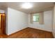 Bright bedroom with hardwood floors and a sun-filled window at 6498 N County Road 475 E, Pittsboro, IN 46167