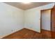 Bedroom featuring hardwood floors, neutral walls, and a doorway to another room at 6498 N County Road 475 E, Pittsboro, IN 46167