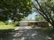 Charming brick home featuring a well-manicured lawn and an attached garage, blending comfort and convenience at 6498 N County Road 475 E, Pittsboro, IN 46167