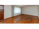 Bright living room with hardwood floors, a front window with natural light and a wood door at 6498 N County Road 475 E, Pittsboro, IN 46167