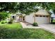 Charming single-story home featuring a two-car garage and well-maintained lawn and landscaping at 7061 Blankenship Ave, Indianapolis, IN 46217