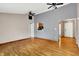 Open living room with wood floor and passthrough to kitchen at 7061 Blankenship Ave, Indianapolis, IN 46217