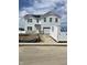 Charming new two-story white home with black roof, garage, and unfinished front yard at 7172 Finley Creek Dr, Whitestown, IN 46075