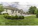 Inviting backyard with a sparkling pool, lush greenery, and comfortable seating areas for relaxation at 7648 Killarney Dr, Indianapolis, IN 46217